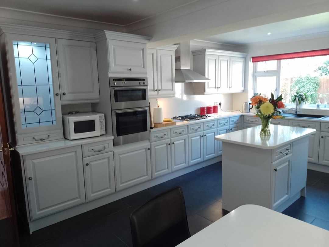 Pale grey traditional kitchen with island unit after respraying